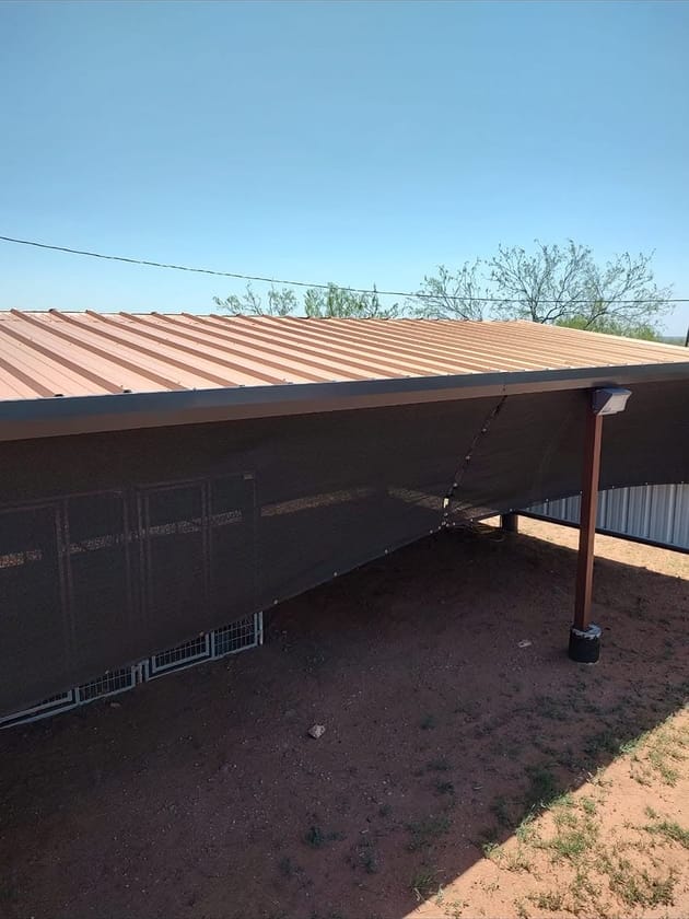 Brown steel roof edge and porch post against the sky